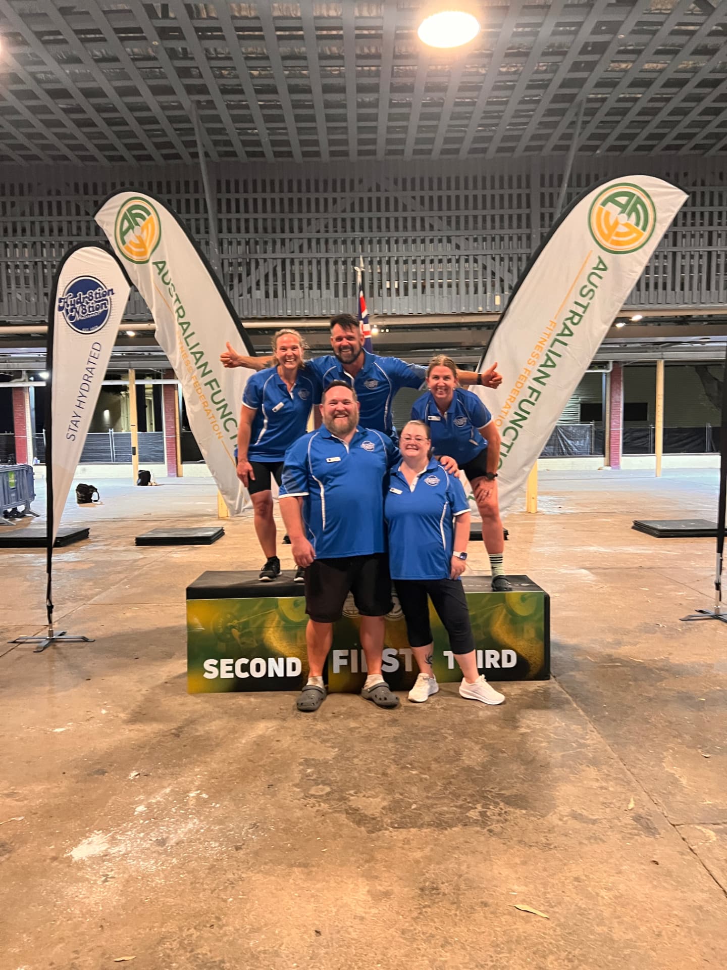 Hydr8tion N8tion team at a live fitness event activation with the Hydr8tion N8tion flag